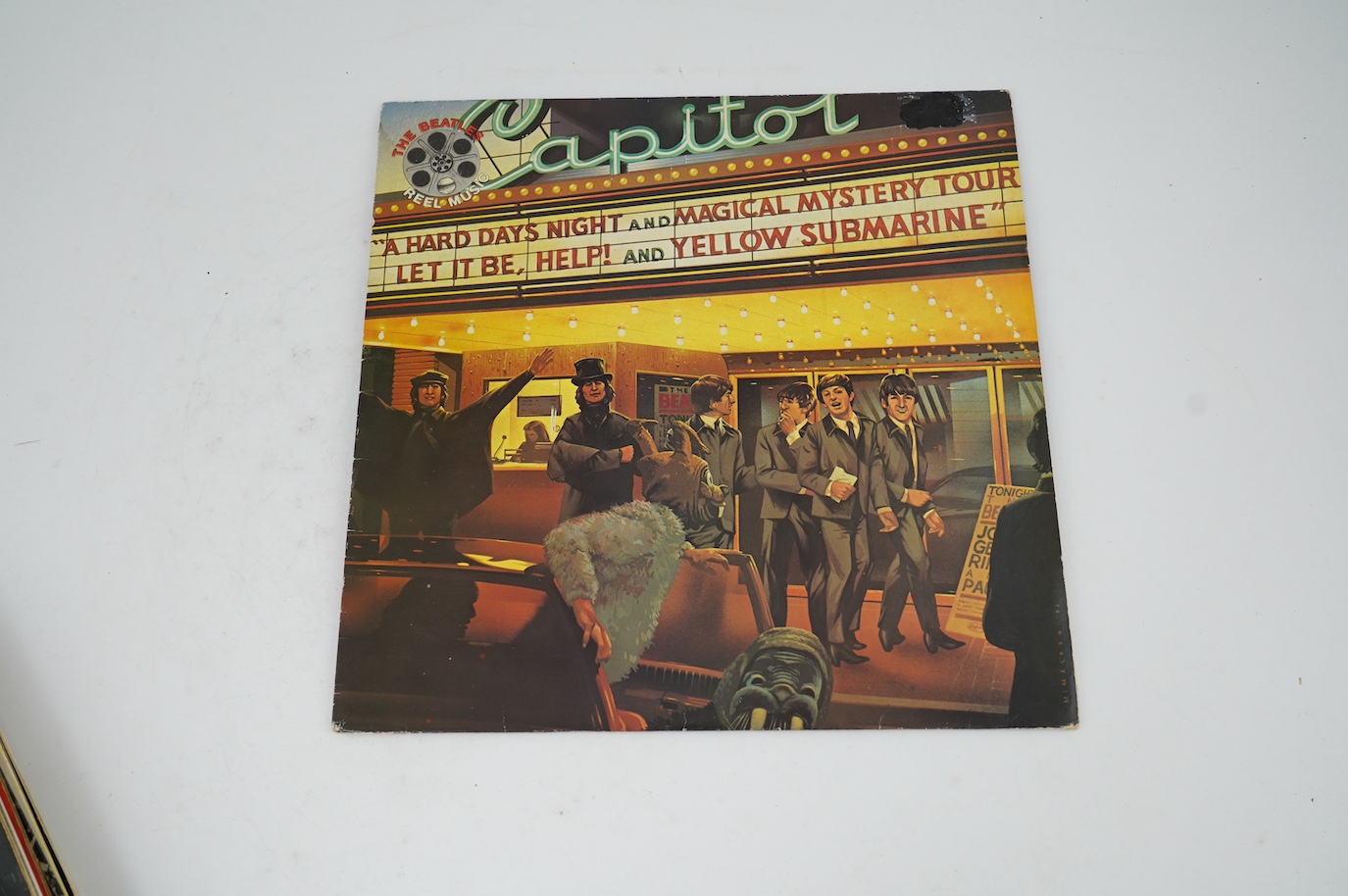 Twelve The Beatles LP record albums including; Revolver, Let It Be, Sgt Pepper and another two (all with card inserts), Beatles For Sale, The Early Years, The Beatles 1962-1966, Abbey Road and another, Hey Jude, Reel Mus